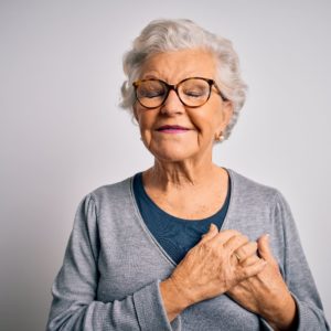 Older woman looking happy and content. Cover for article about senior's mental health.