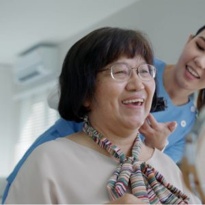 Older woman and her nurse. Cover image for article about in-home and alternative care.