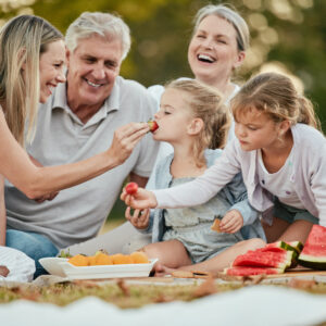Family enjoying fruit and other inflammation-reducing foods for seniors