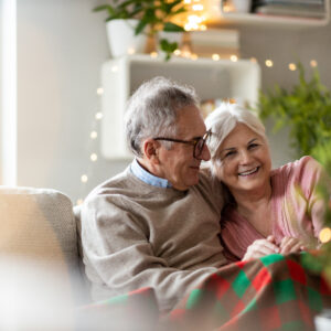 Couple enjoying the holidays after making proper winter preparations for seniors at home