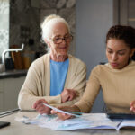 Family going over documents and managing caregiver expenses