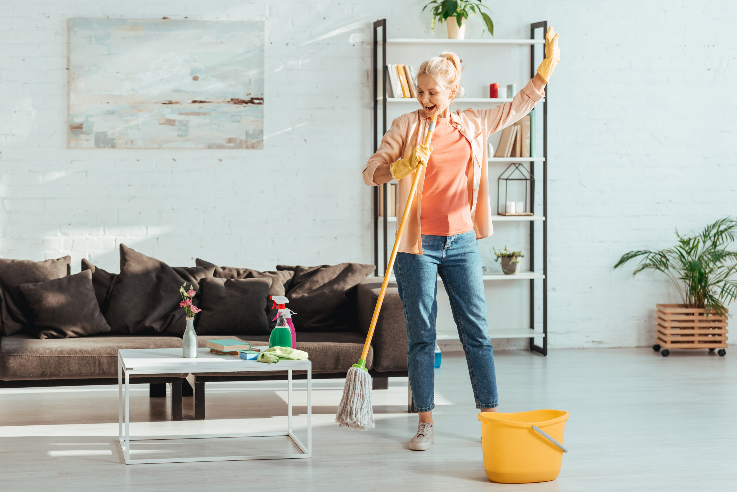 Woman making use of spring cleaning tips for seniors