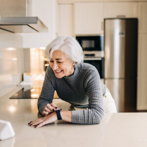 An older woman enjoying the benefits of virtual assistants for seniors