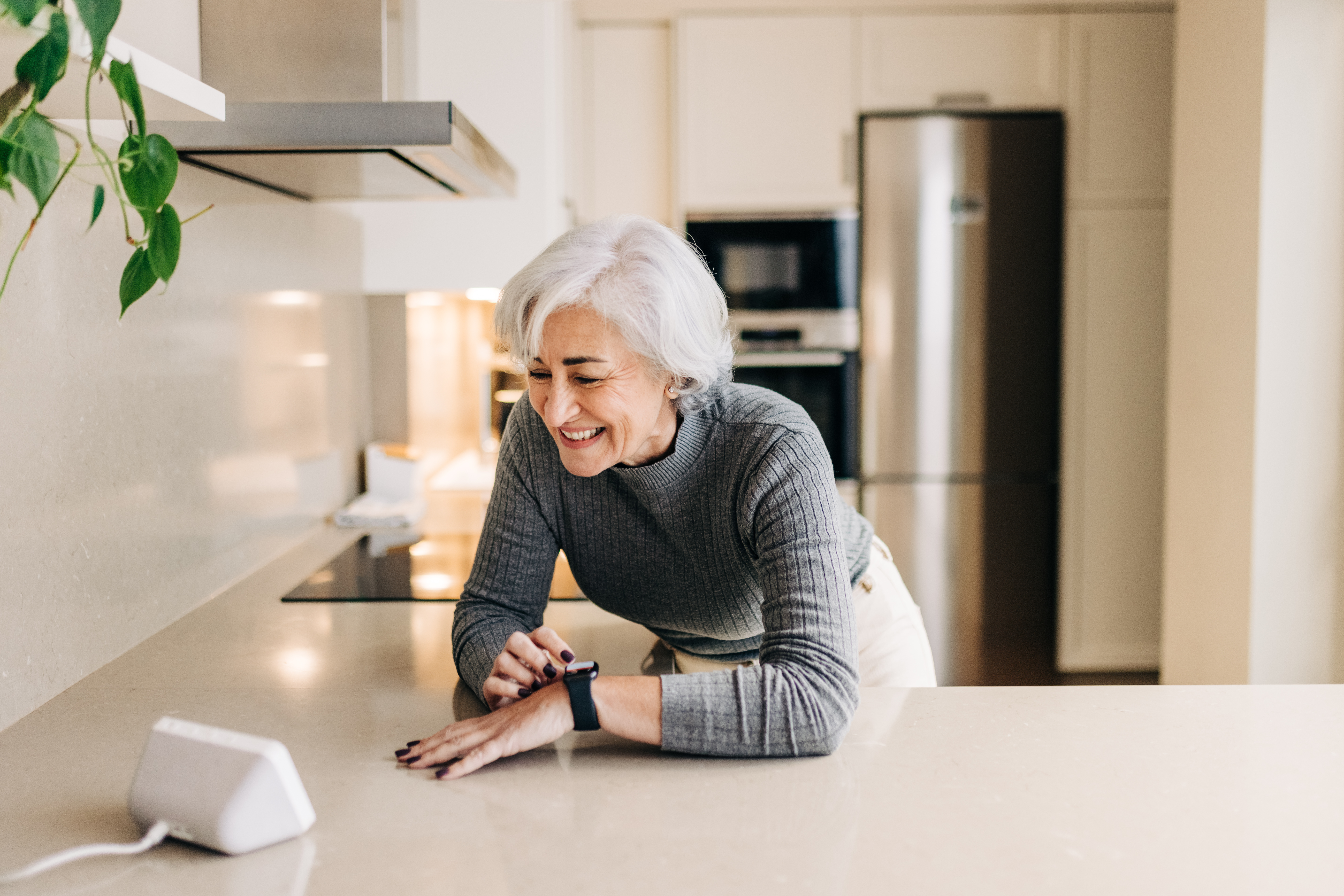 An older woman enjoying the benefits of virtual assistants for seniors