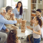 Seniors engaging in social time with family, part of a healthy routine for seniors