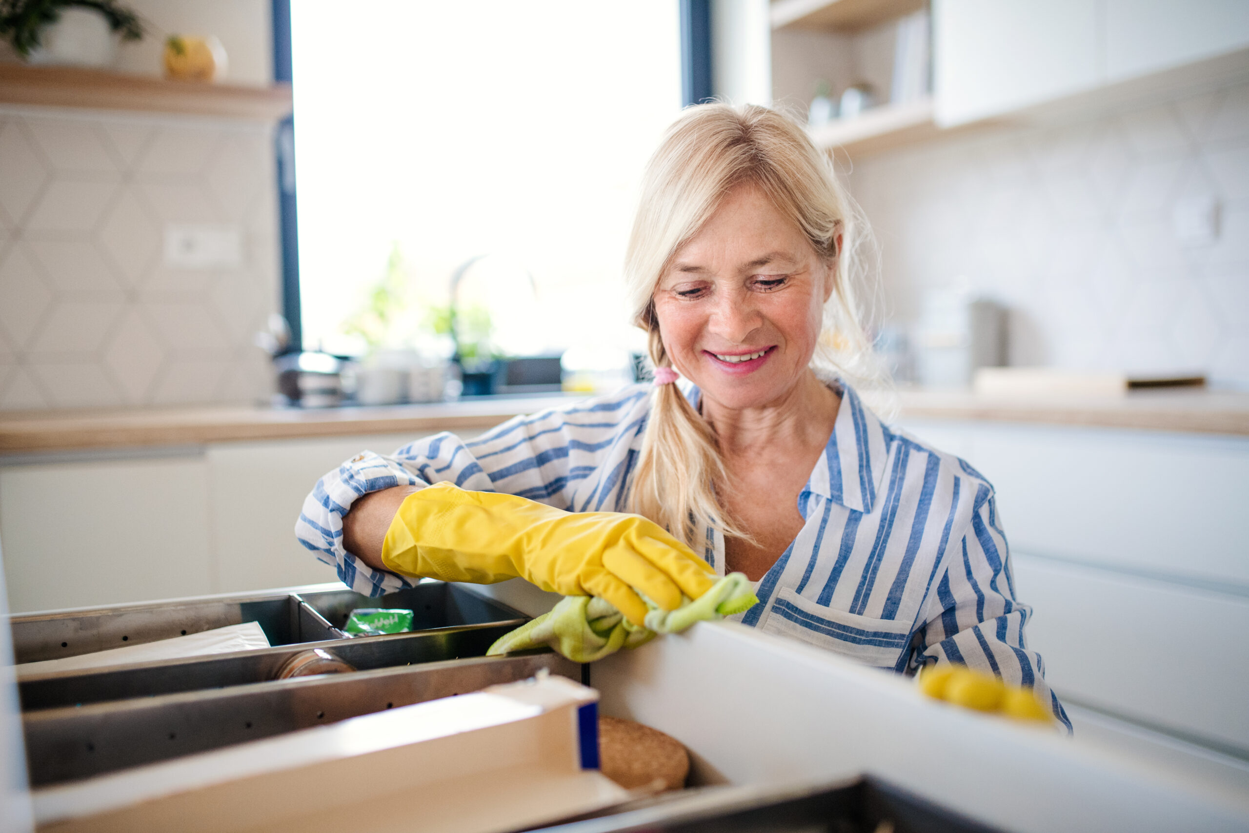 Senior woman organizing her home for aging-in-place